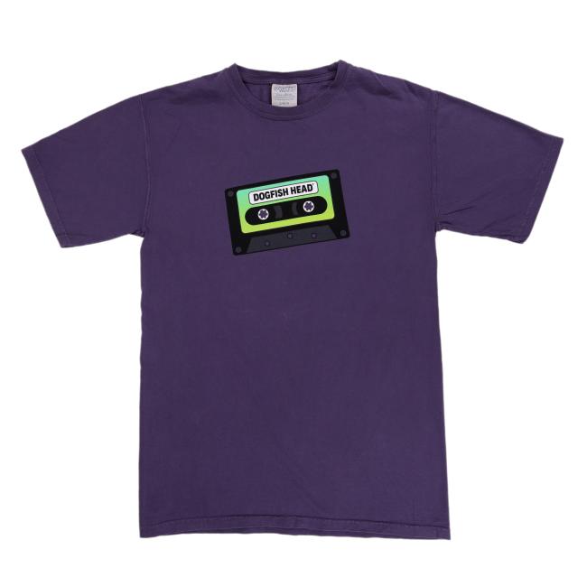 Purple short sleeve t-shirt with a green and black cassette tape graphic that says “Dogfish Head” on the front center.