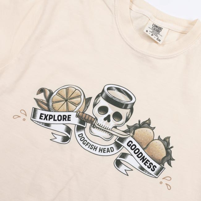 Ivory short sleeve tee shirt with skull and fruit Explore Goodness artwork.