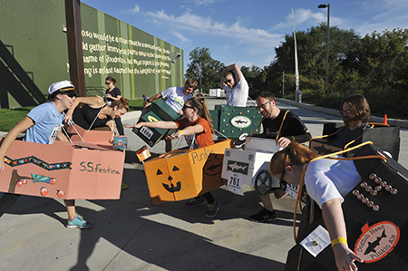 DASH runners dressed up in various reused Dogfish beer case boxes